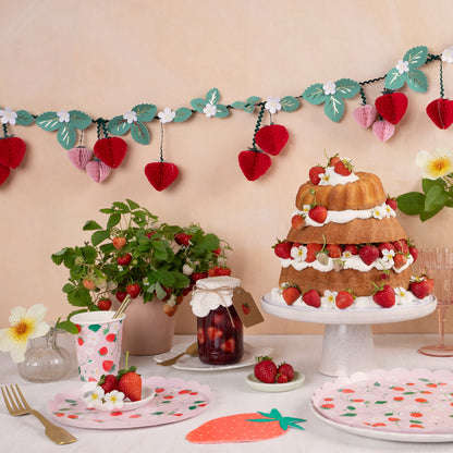 strawberry themed party supplies with matching hanging banner by meri meri 