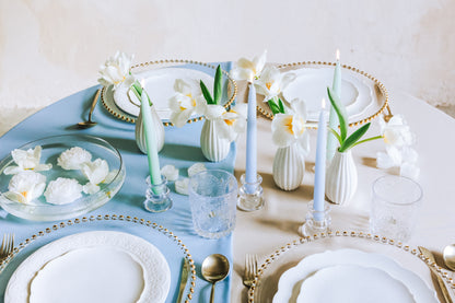 mix of mint green and light blue candles on table setup