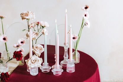 tapered candles mixed with florals displayed on table