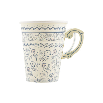 white paper cup resembling a tea cup with handle and blue floral pattern