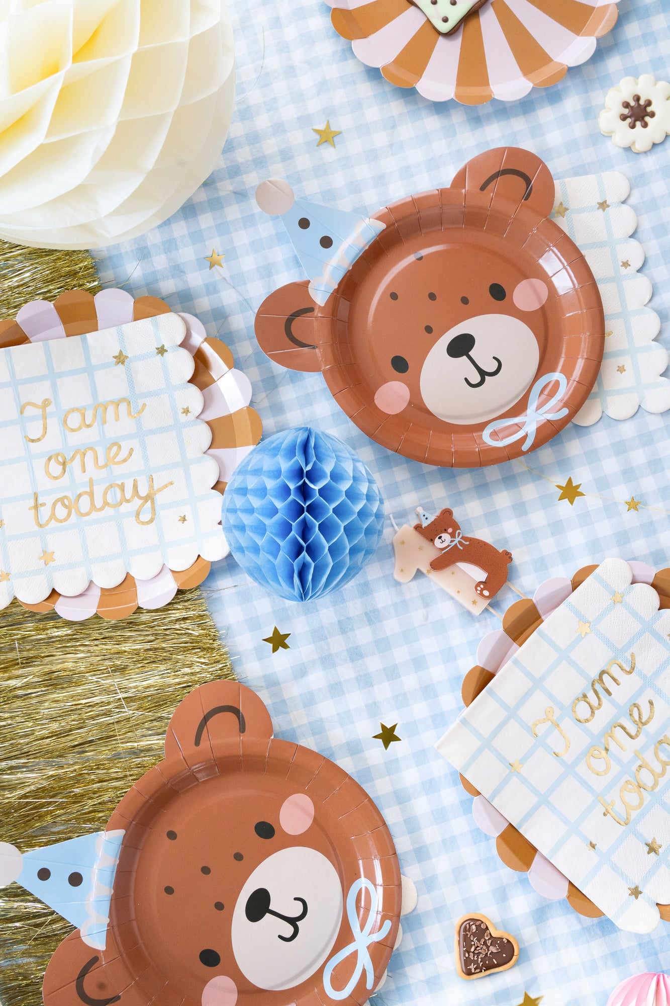 first birthday teddy bear themed party supplies. Plates, napkins, candles, confetti and paper fans