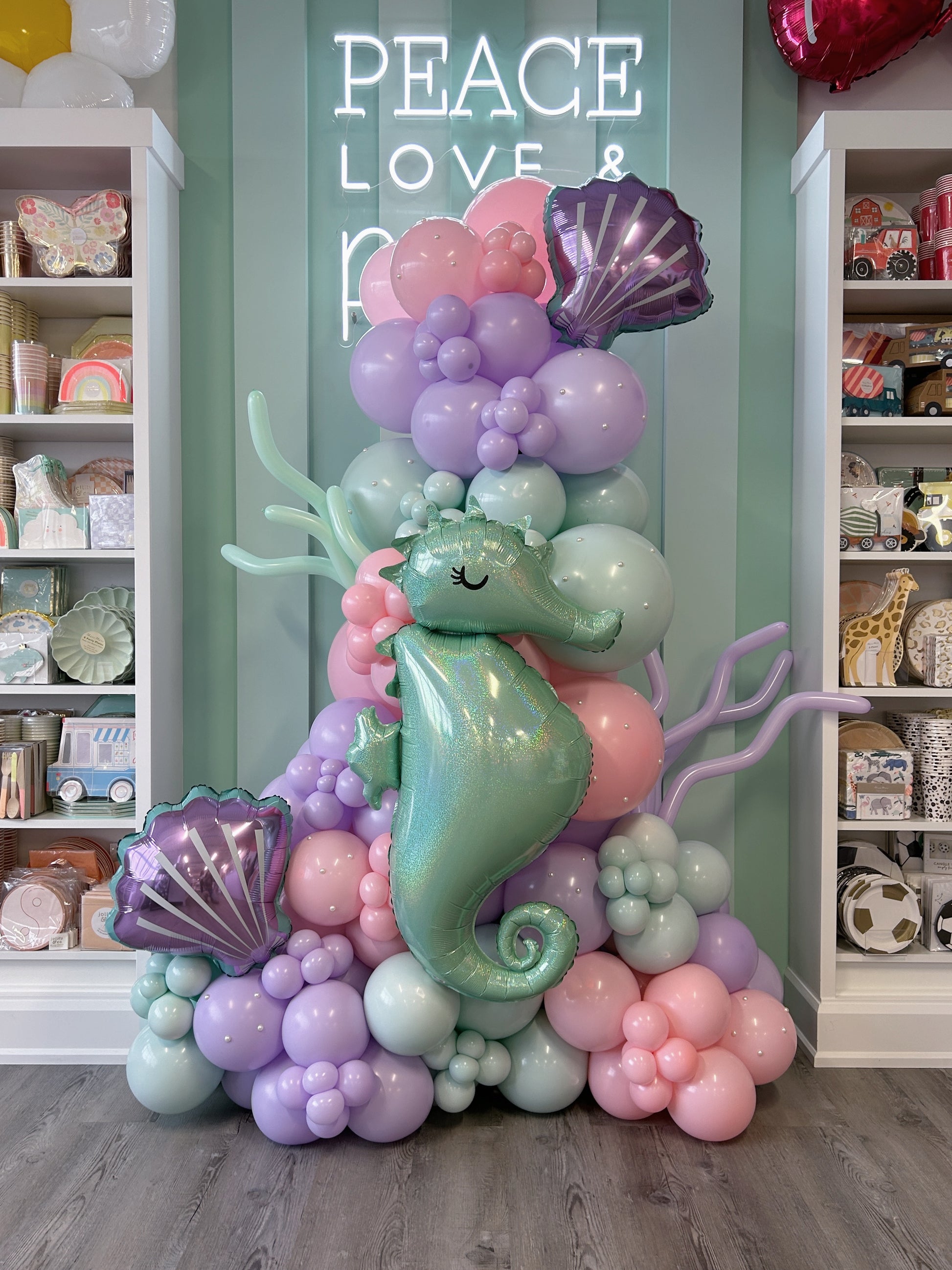 under the sea balloon garland featuring seashells, seahorses, corals and pearls 