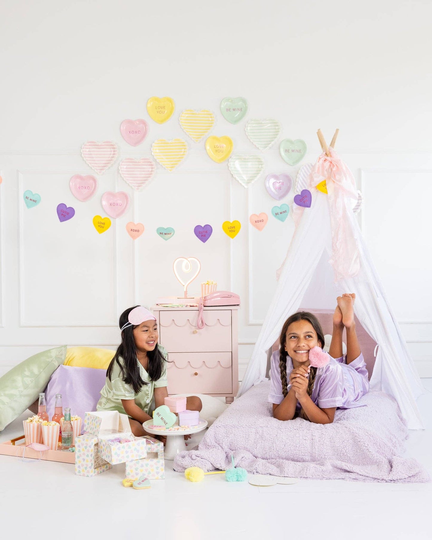 valentines day photoshoot with conversation hearts decor 