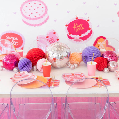 valentine's day table setting with wall decor and disco ball table runner