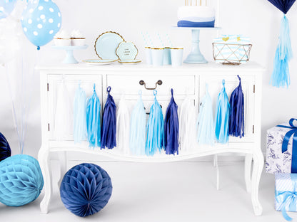 tablescape including a blue and white tassel garland